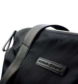 Sac à langer Storksak + Bugaboo en cuir noir (cuir avec intérieur bleu pétrole)