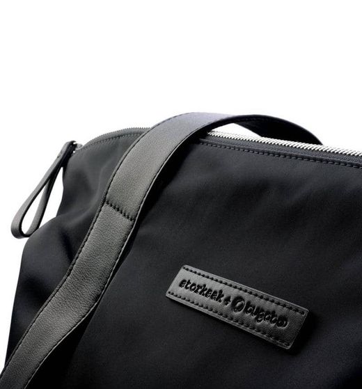 Sac à langer Storksak + Bugaboo en cuir noir (cuir avec intérieur bleu pétrole)